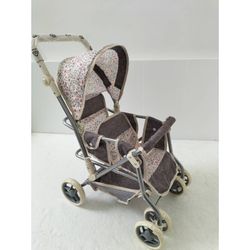 COCHE GEMELOS RUEDA GIRATORIA ESTAMPADO BEIGE
