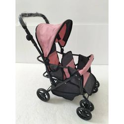 COCHE GEMELOS RUEGA GIRATORIA ROSA-NEGRO