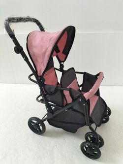 COCHE GEMELOS RUEGA GIRATORIA ROSA-NEGRO